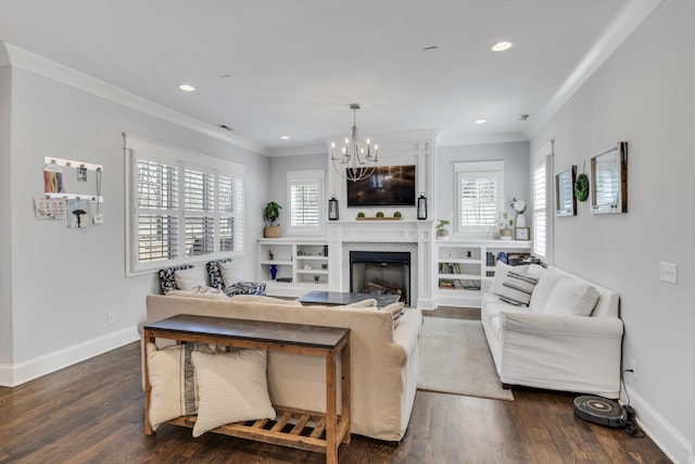 living area with dark wood-style flooring, crown molding, and baseboards