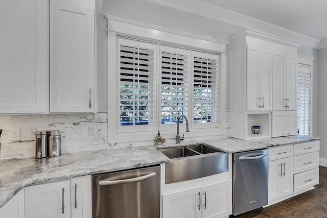 kitchen with a sink, white cabinetry, light stone countertops, dishwasher, and crown molding