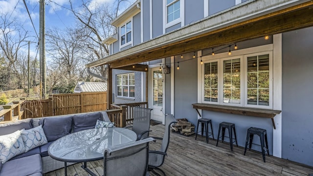 deck with fence and an outdoor hangout area