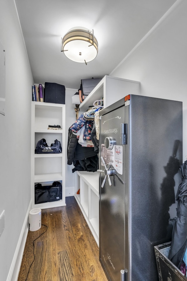 walk in closet featuring wood finished floors