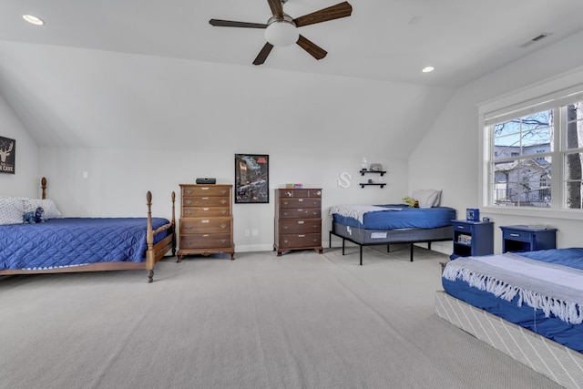 carpeted bedroom featuring visible vents, vaulted ceiling, a ceiling fan, and recessed lighting