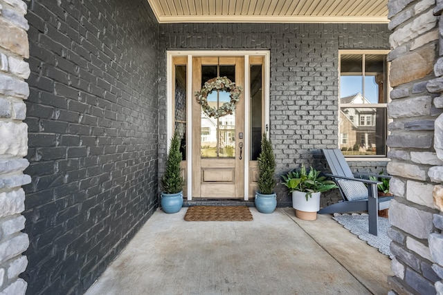 entrance to property with brick siding