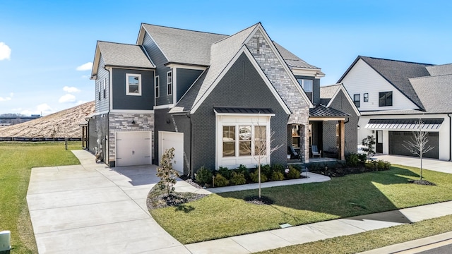 view of front of house featuring an attached garage, a front yard, a standing seam roof, metal roof, and driveway