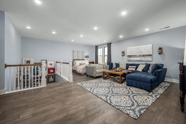 living room with visible vents, wood finished floors, and recessed lighting