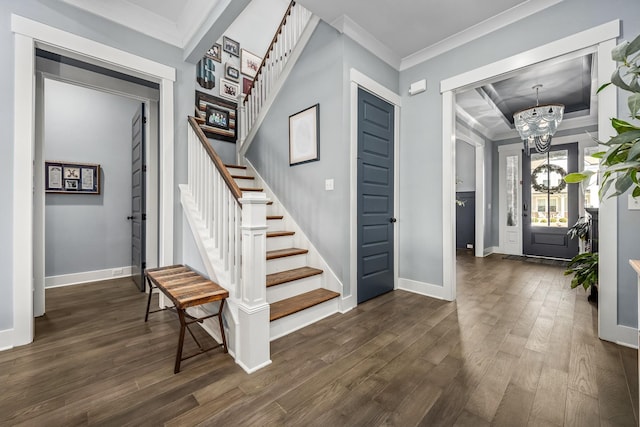 entryway featuring a chandelier, dark wood-type flooring, baseboards, stairway, and crown molding