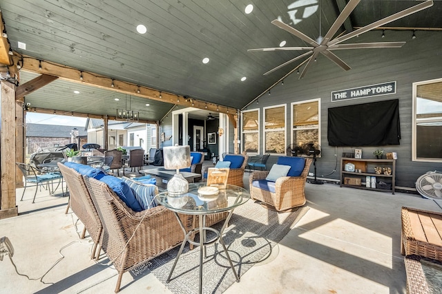 view of patio featuring a ceiling fan, outdoor dining area, and an outdoor living space