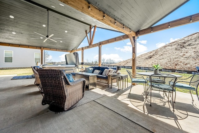 view of patio / terrace featuring a ceiling fan, outdoor dining area, and an outdoor living space