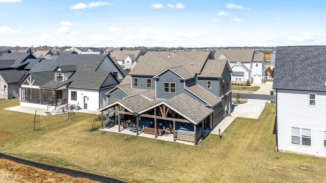 birds eye view of property with a residential view