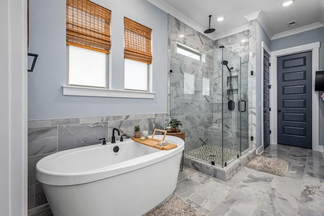 bathroom featuring marble finish floor, visible vents, a freestanding bath, and a stall shower