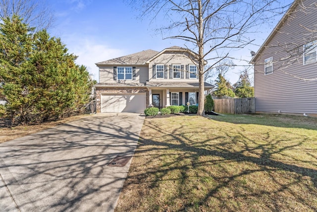 view of front facade with driveway, a garage, fence, and a front yard