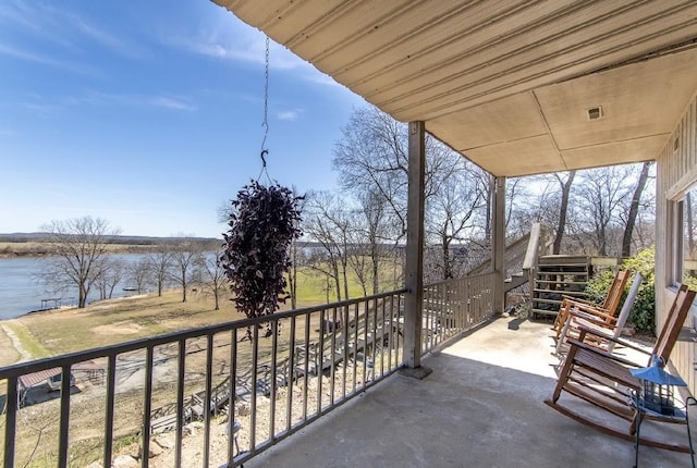 balcony featuring a water view