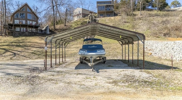 view of parking / parking lot with a carport and driveway