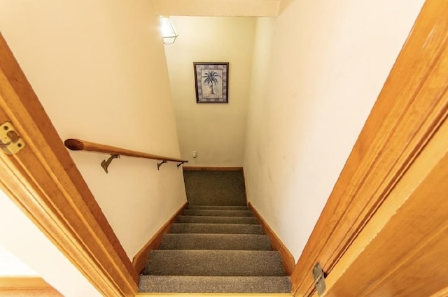 stairs with carpet flooring and baseboards