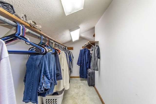 spacious closet with carpet flooring