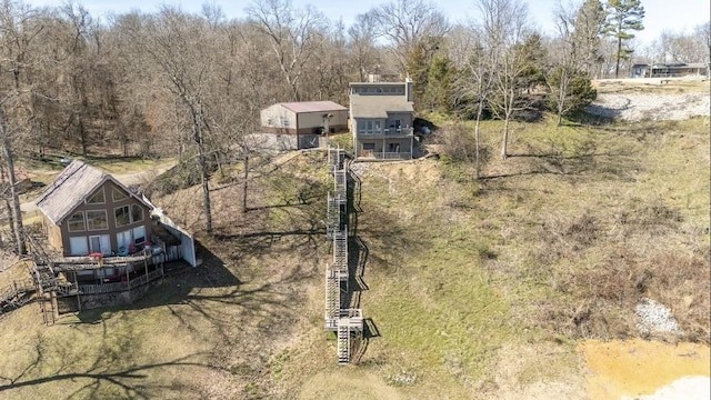 drone / aerial view featuring a view of trees