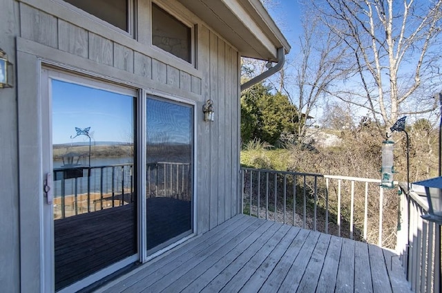 wooden terrace with a water view