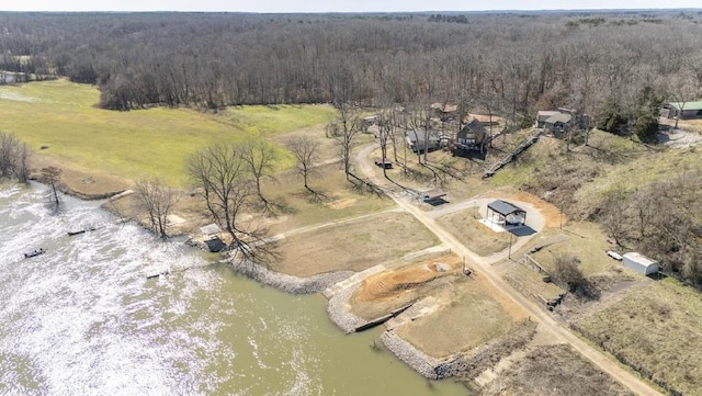 aerial view featuring a water view, a forest view, and a rural view