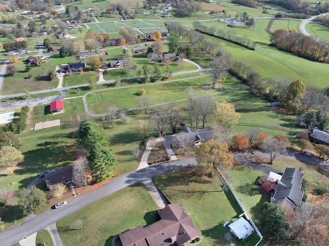 birds eye view of property with a rural view