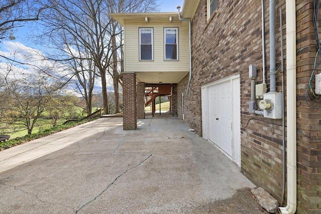 view of property exterior with brick siding