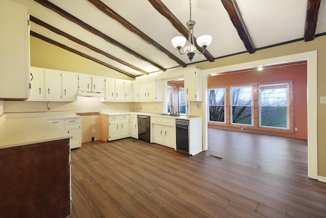 kitchen with dark wood-style flooring, a notable chandelier, lofted ceiling with beams, under cabinet range hood, and dishwashing machine