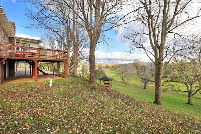 view of yard featuring a wooden deck