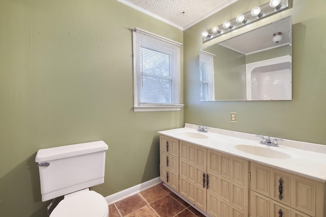 bathroom with a textured ceiling, ornamental molding, a sink, and toilet