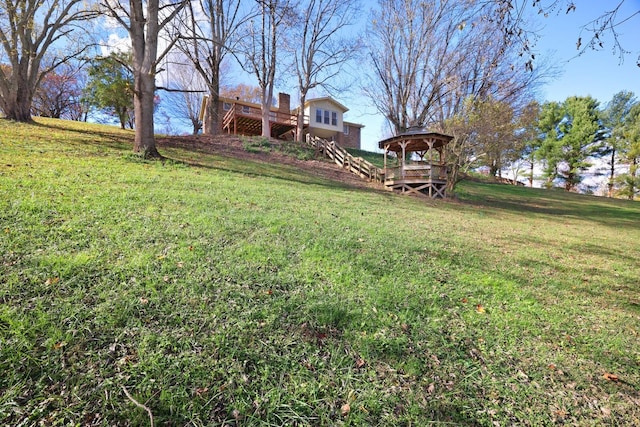 view of yard with stairway and a wooden deck