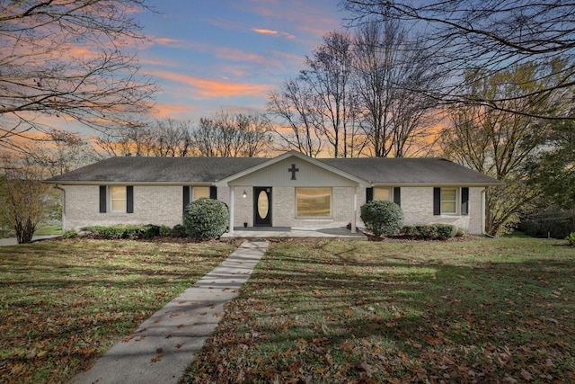157 Hillcrest Cir, Gordonsville, TN 38563 - view of front of home with brick siding and a yard