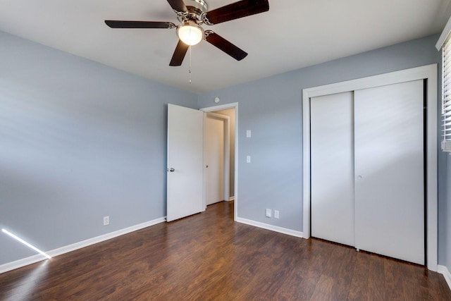 unfurnished bedroom with ceiling fan, a closet, baseboards, and wood finished floors