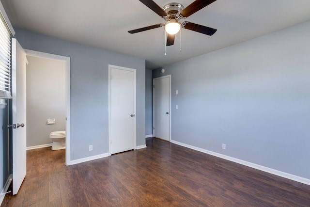 unfurnished bedroom with a ceiling fan, connected bathroom, baseboards, and wood finished floors