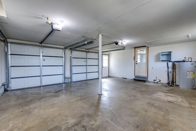 garage featuring a garage door opener and electric water heater