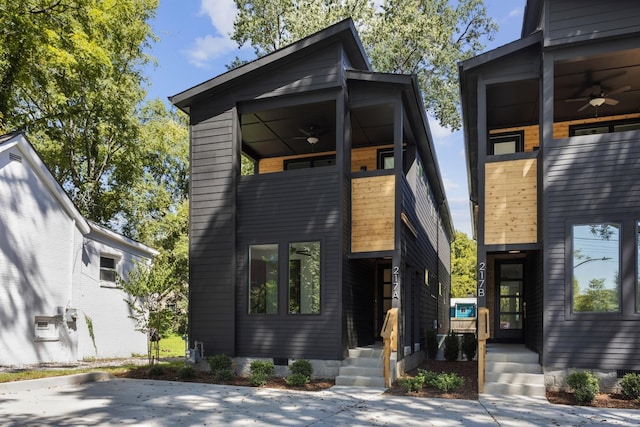 modern home featuring a balcony and a ceiling fan