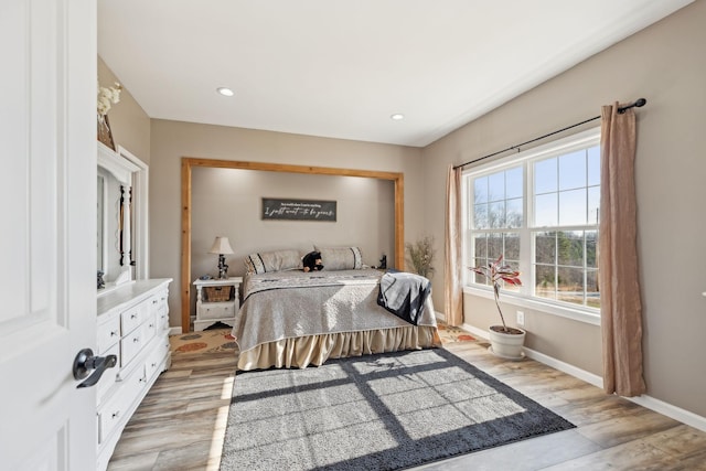 bedroom featuring light wood-style flooring, baseboards, and recessed lighting