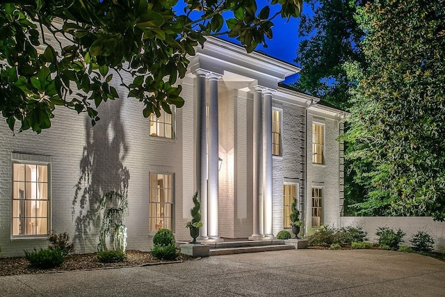 view of front of home featuring brick siding