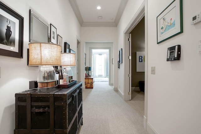 hallway featuring light carpet, baseboards, ornamental molding, and recessed lighting