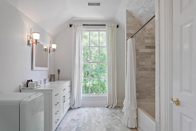 full bath with marble finish floor, lofted ceiling, washer / clothes dryer, visible vents, and vanity