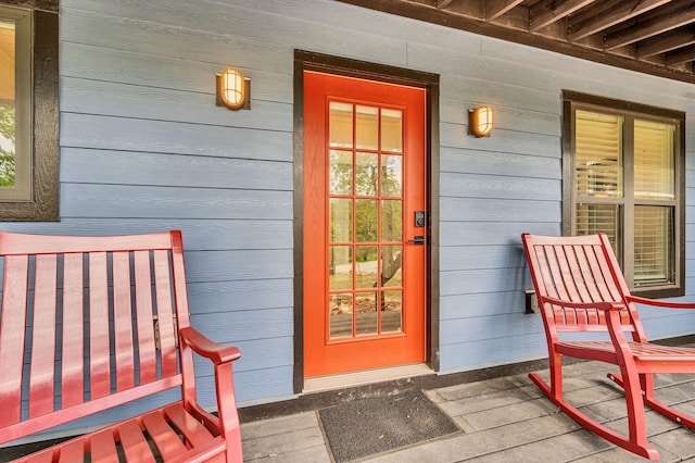 view of exterior entry with covered porch