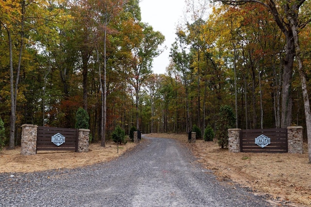 view of street featuring a wooded view