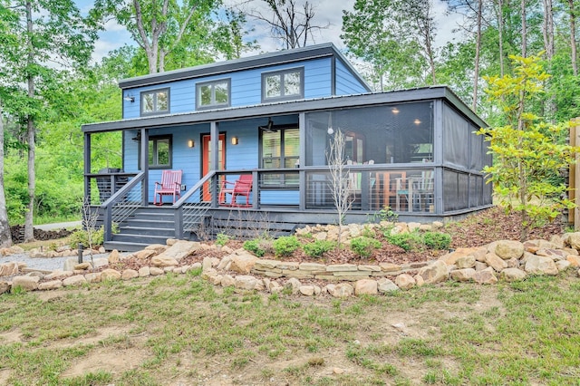 view of front facade featuring a porch and a sunroom