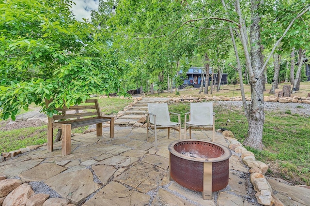 view of patio featuring a fire pit