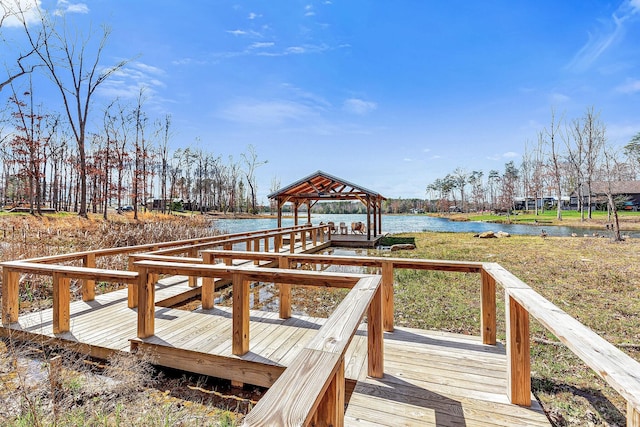 view of dock with a gazebo and a water view