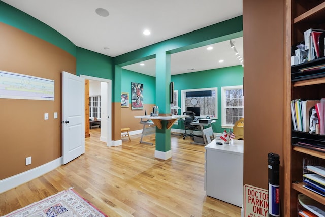 office featuring light wood-style floors, baseboards, and recessed lighting