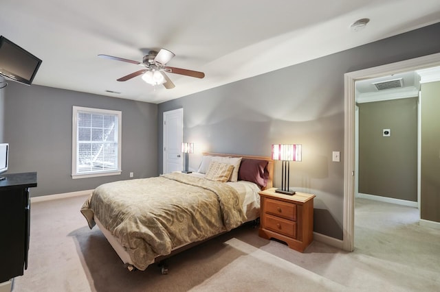 bedroom with light colored carpet, visible vents, and baseboards