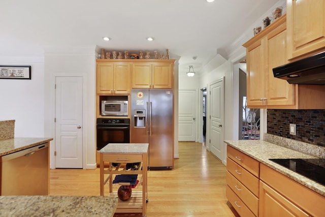 kitchen featuring black appliances, under cabinet range hood, ornamental molding, and light brown cabinetry