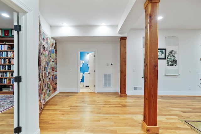 interior space with light wood-style floors, recessed lighting, and visible vents