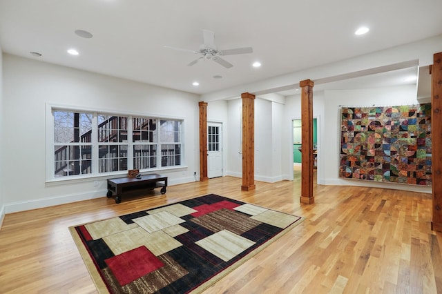 workout area featuring recessed lighting, baseboards, ornate columns, and wood finished floors