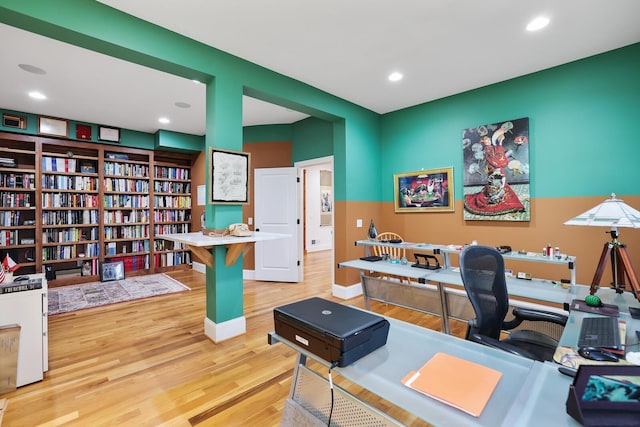 office with recessed lighting, baseboards, and wood finished floors