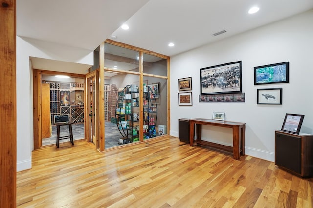 home office featuring baseboards, visible vents, wood finished floors, and recessed lighting