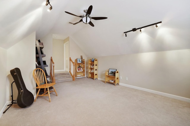 sitting room featuring lofted ceiling, carpet floors, a ceiling fan, baseboards, and track lighting