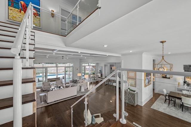 interior space featuring ceiling fan, wood finished floors, and recessed lighting